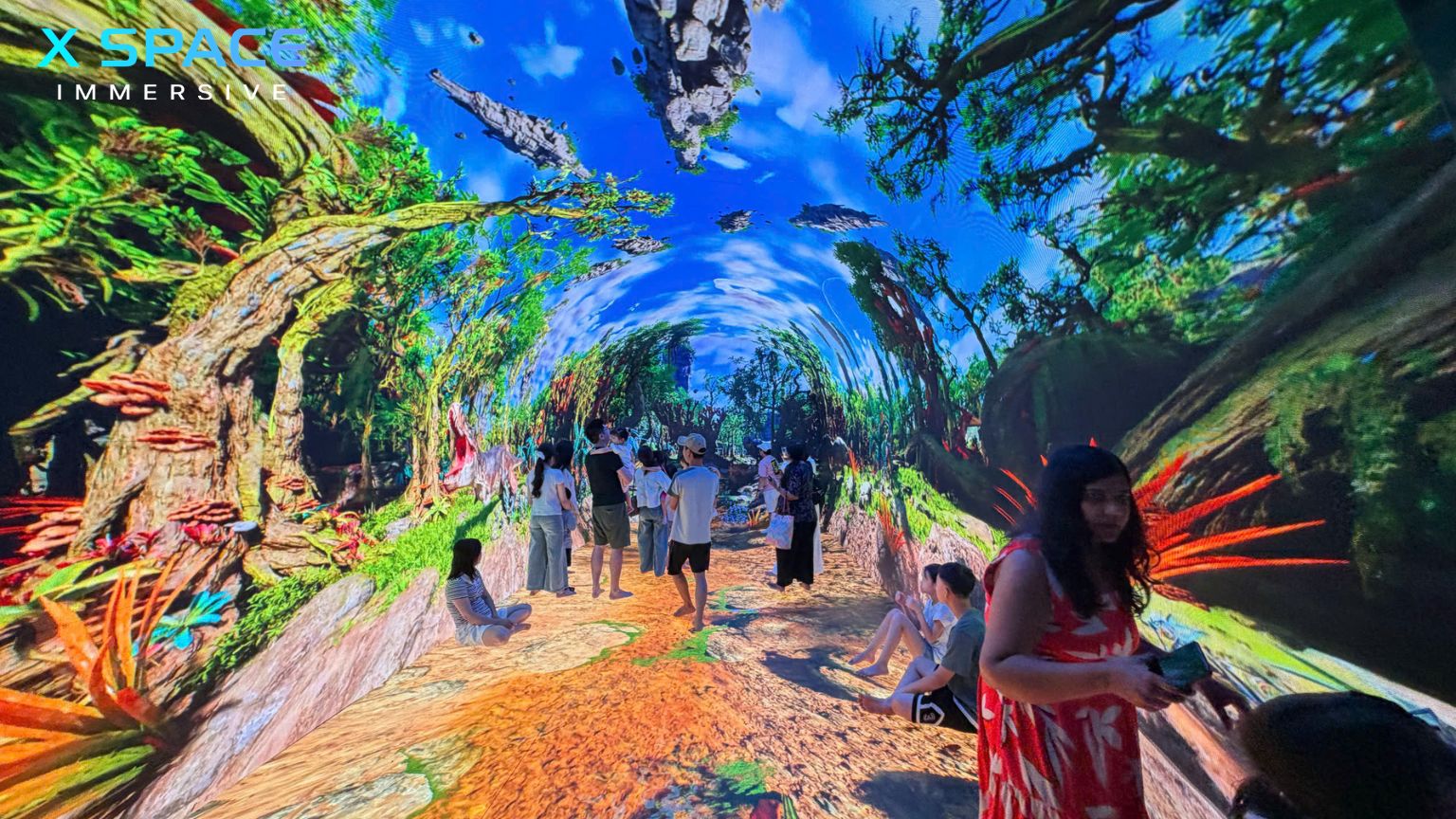 Family exploring Experience X Space Immersive digital art attraction in Hanoi