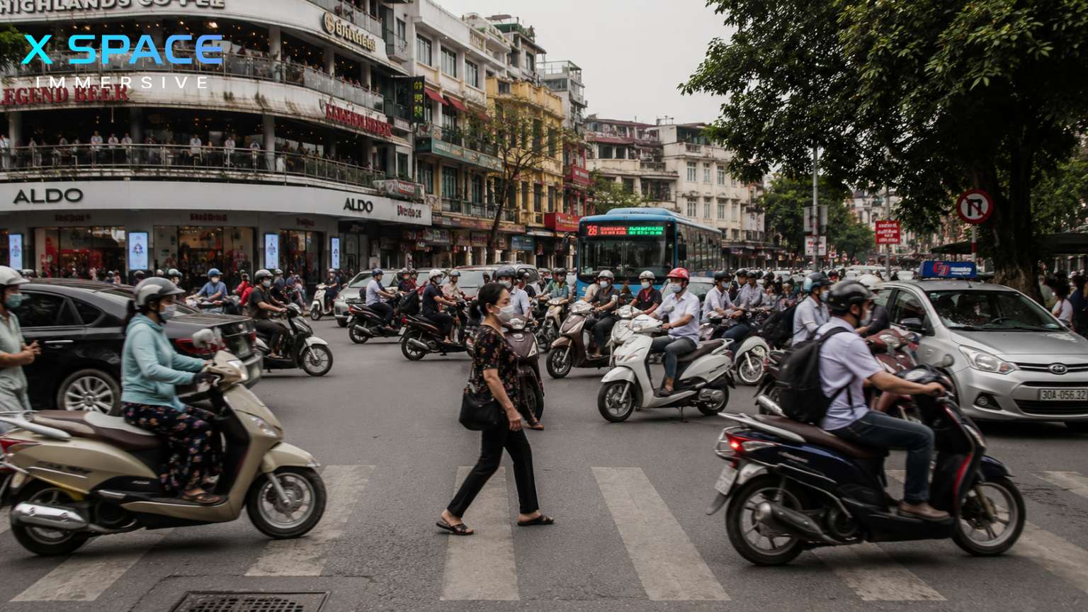 Busy traffic intersection illustrating places to be cautious in Hanoi